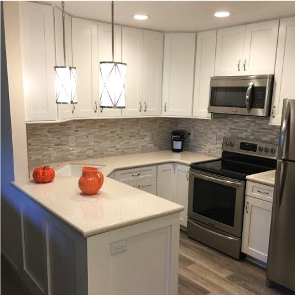 Beautiful backsplash and countertop combo makes even a small kitchen look great!