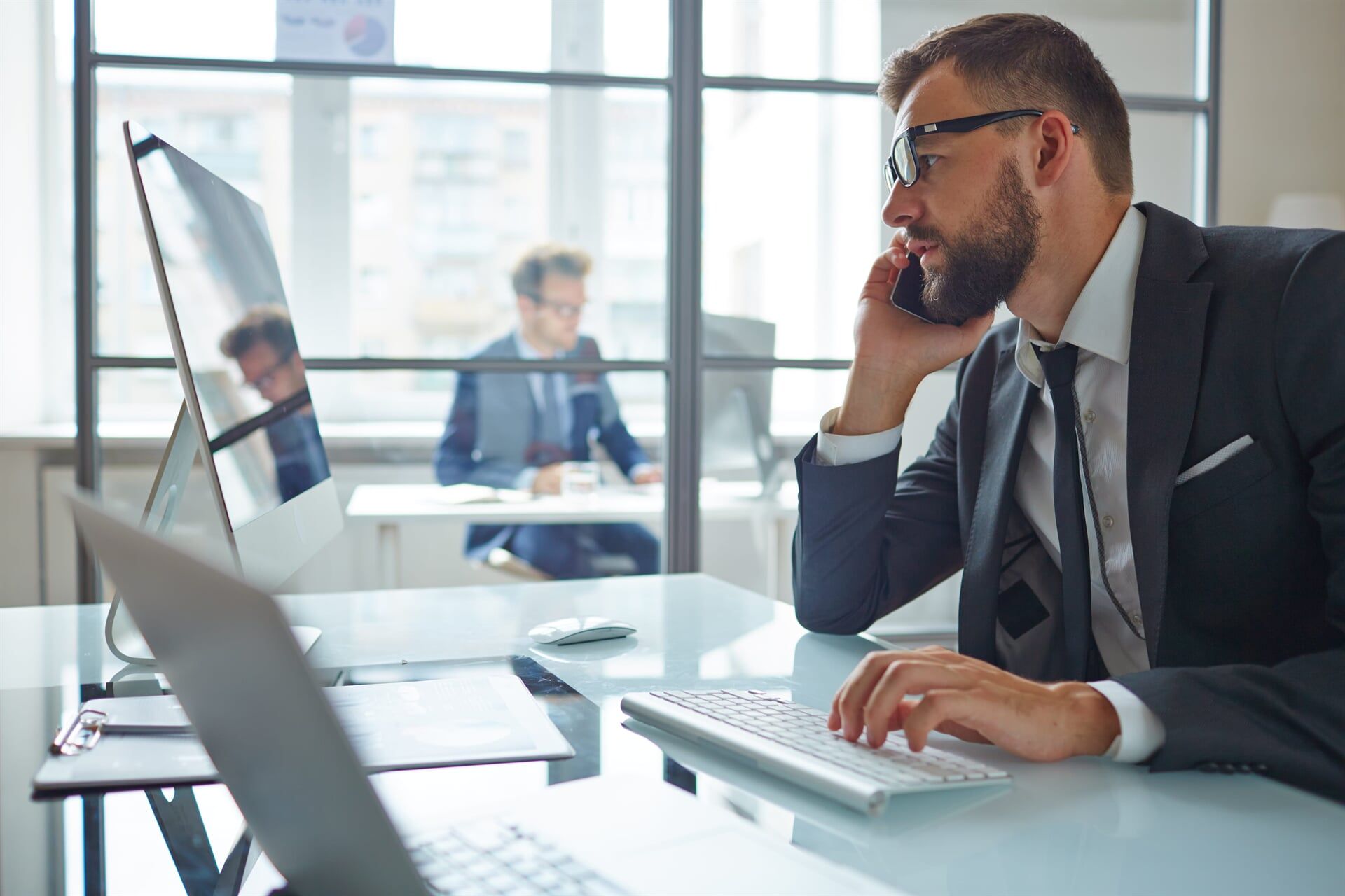 Businessman Working At The Office — North Coast Commercial Doors in Newcastle, NSW