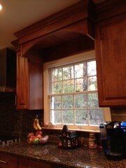 Cabinetry Around a Kitchen Window - Modern Trend Kitchens & Baths