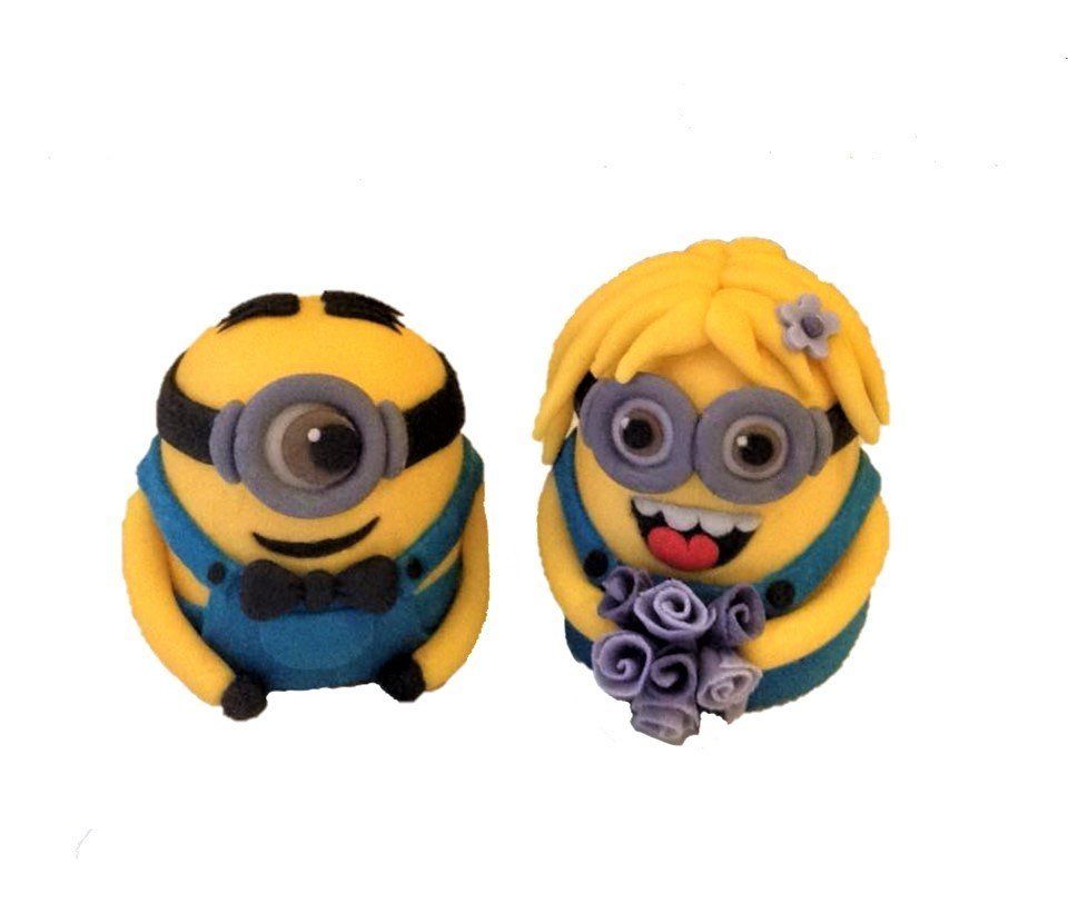 Two Minion-shaped figures: one male with a bow tie, one female with flowers, wearing blue overalls.