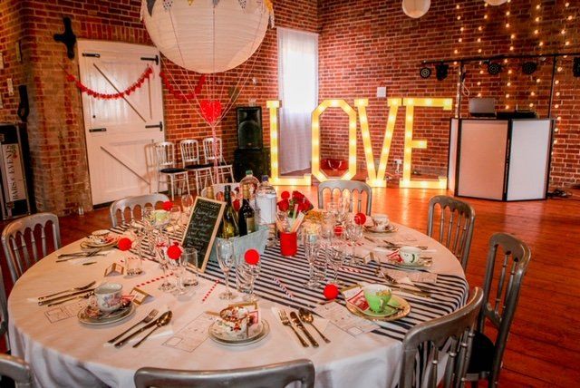 A wedding reception with a round table set for guests, 