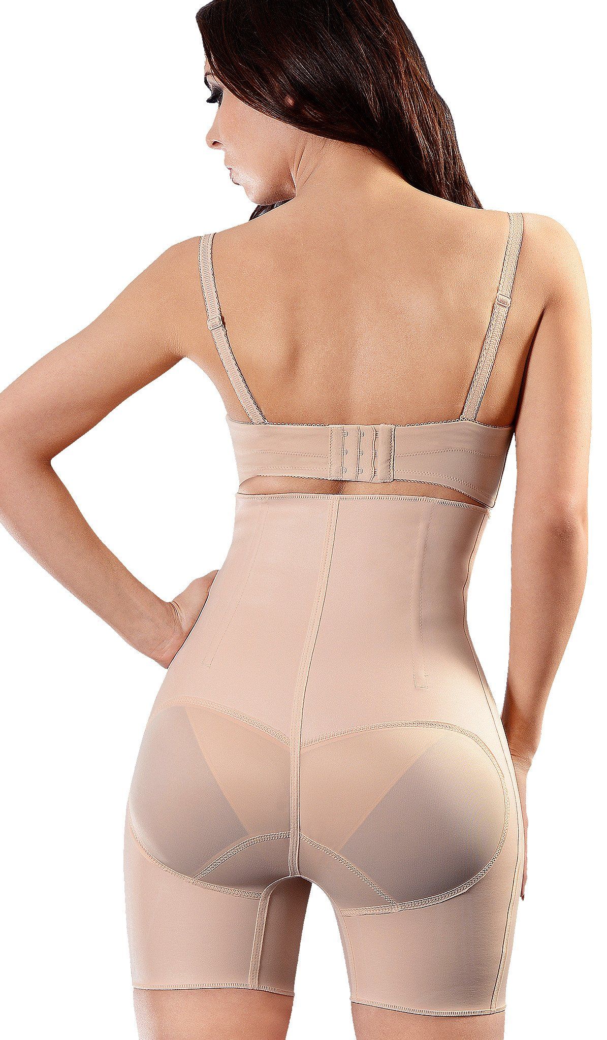 Woman wearing a nude-colored shapewear garment. The garment includes a built-in bra and extends down to mid-thigh.