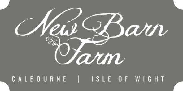Logo for New Barn Farm, white script on a gray rectangle. Location: Calbourne, Isle of Wight.