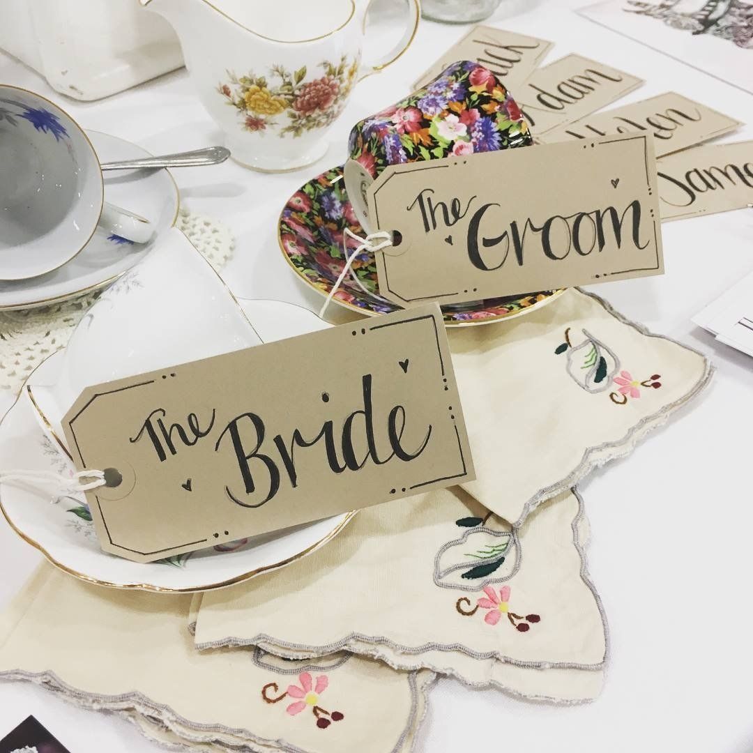 Tags on teacups and embroidered handkerchiefs, labeled