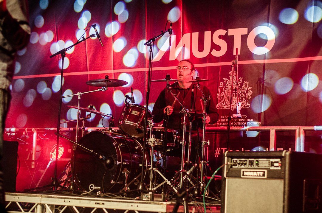 Drummer on stage under the
