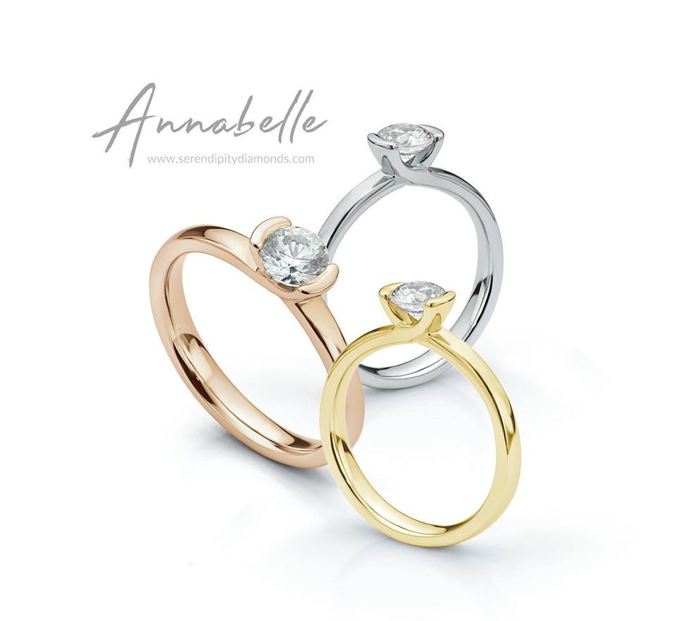 Three diamond rings: rose gold, white gold, and yellow gold. Each has a single, round-cut diamond.