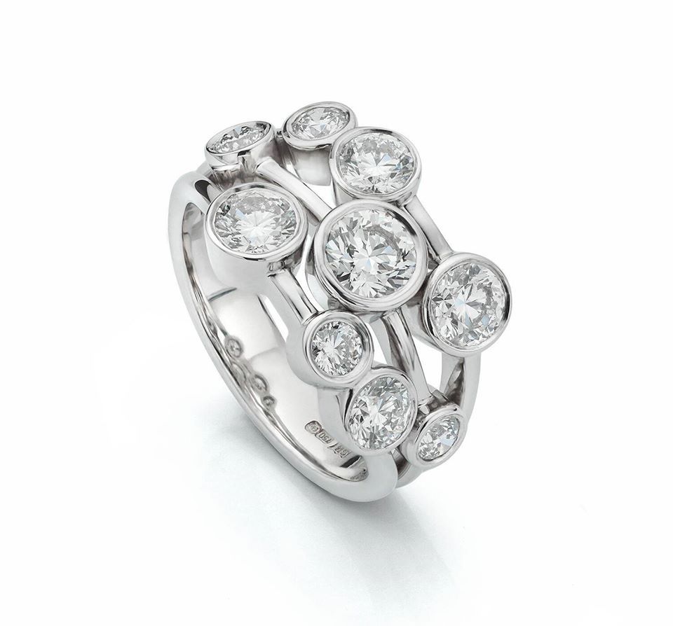 Diamond cluster ring in white metal.