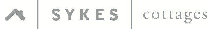 Sykes Cottages logo with a house icon and text