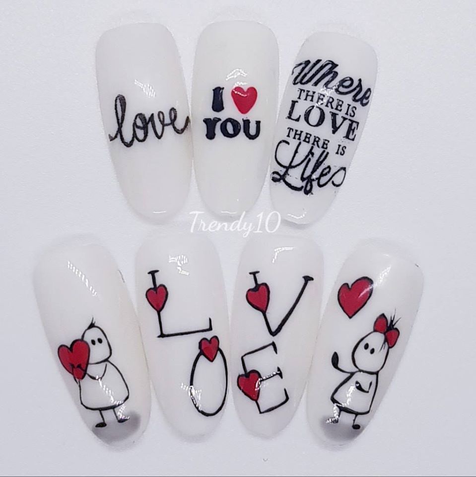 White nail art with hearts, the word