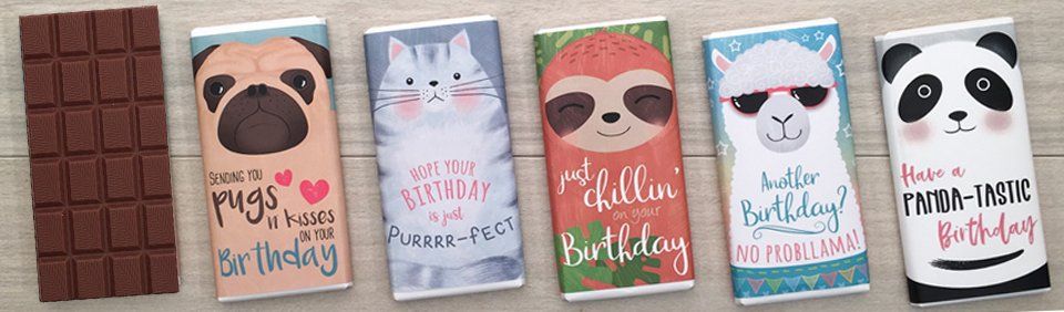 Chocolate bars with animal-themed wrappers: pug, cat, sloth, llama, and panda; white table background.