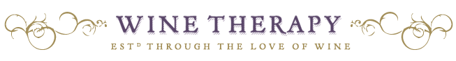 Wine Therapy logo with scrolling floral accents and text