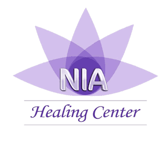 Nia Healing Center logo: purple lotus flower with 