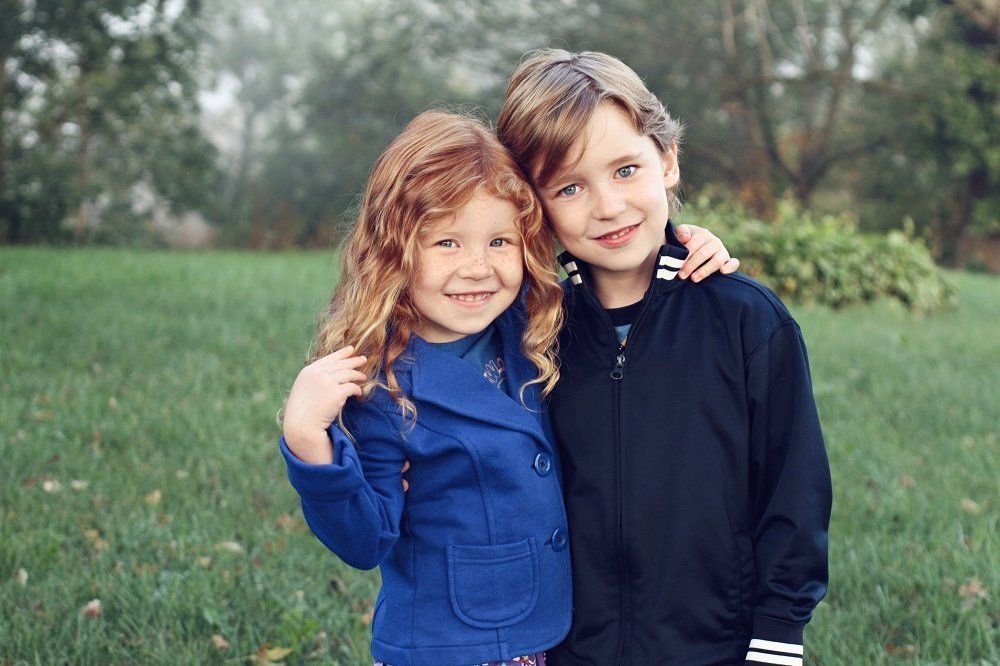 Two siblings photographed together