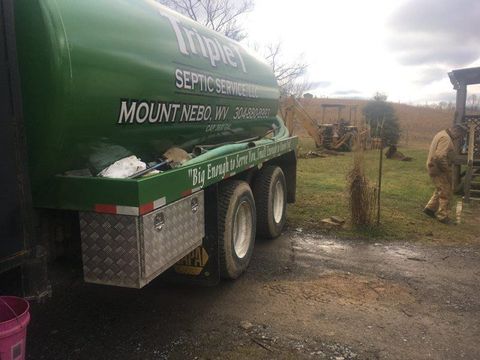 Workers Doing Septic Pumping — Mount Nebo, WV — Triple T Septic Service LLC Workers Doing Septic Pumping — Mount Nebo, WV — Triple T Septic Service LLC