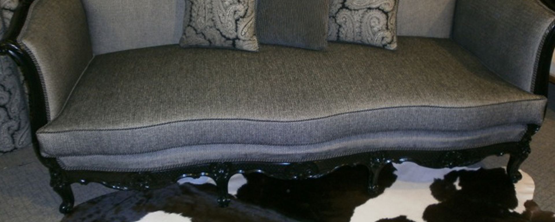 Three seater upholstered sofa