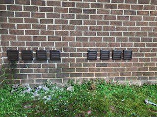 closed dryer vents on exterior of brick building