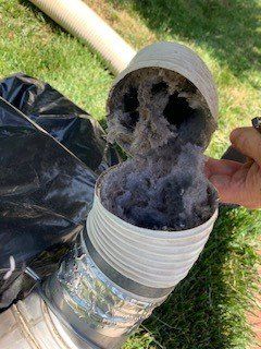 dryer vent dust in opened vent