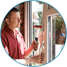 Worker Installing New Windows In House - Window & Door Installation in Cheyenne, WY Worker Installing New Windows In House - Window & Door Installation in Cheyenne, WY