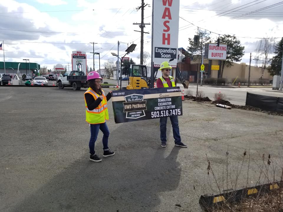 holding sign - UWD Prebuild