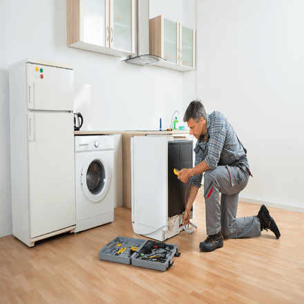Appliance — A Worker Fixing The Washing Machine in Westerly, RI Appliance — A Worker Fixing The Washing Machine in Westerly, RI