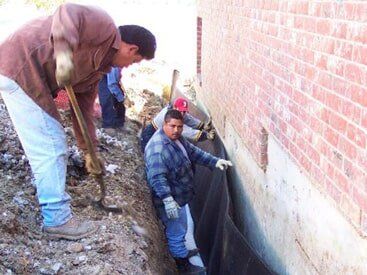 worker working on foundation - foundation repair and inspection in Garland, TX worker working on foundation - foundation repair and inspection in Garland, TX