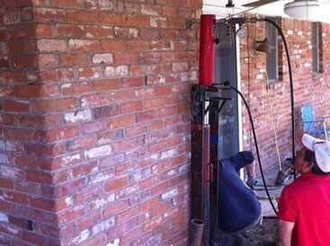 working on pier - foundation repair and inspection in Garland, TX