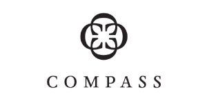Compass logo with a geometric floral design above the word
