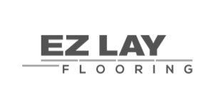 EZ Lay Flooring logo with text and lines.