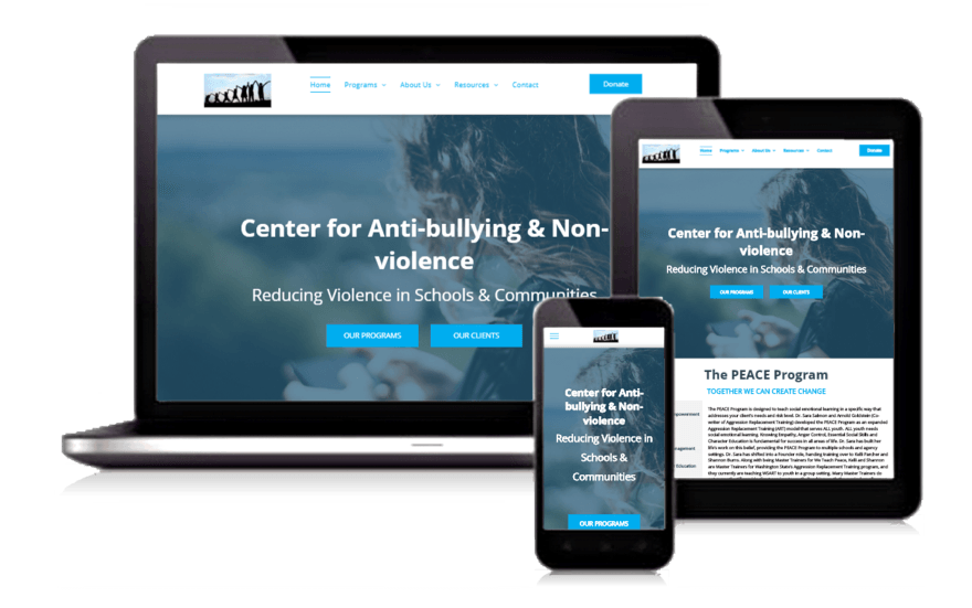 Laptop, tablet, and phone displaying an anti-bullying and nonviolence website on a blue background