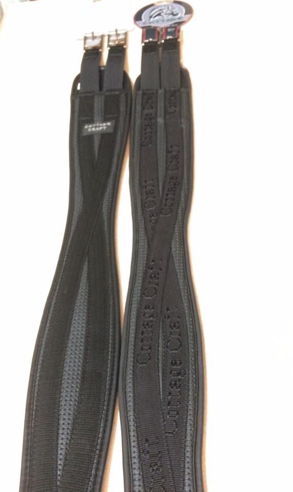 a pair of black saddles with the word current on them