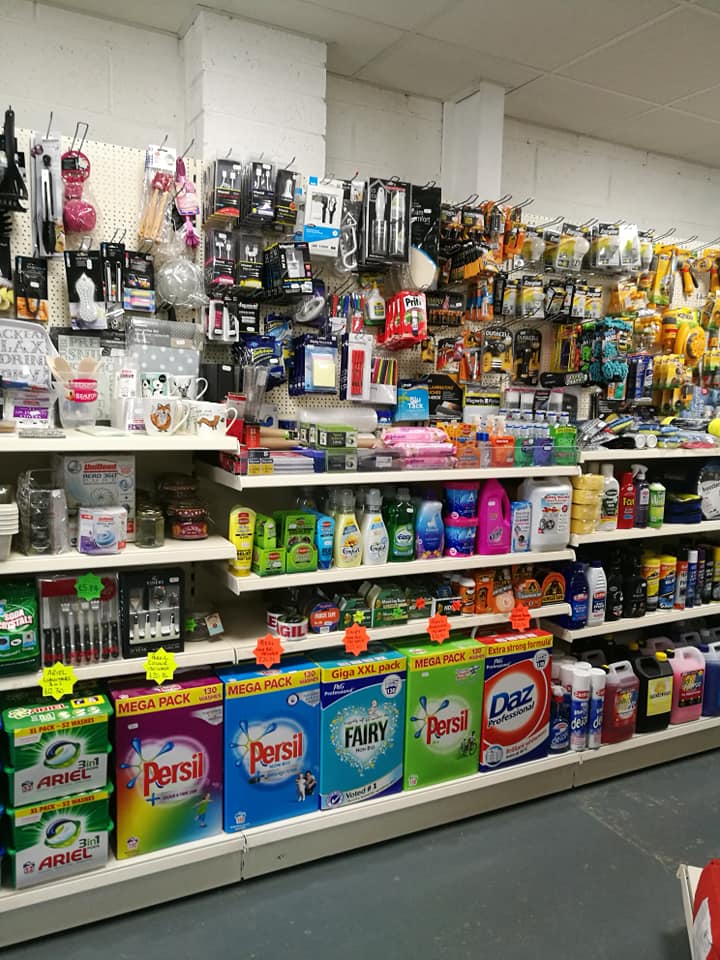 a store shelf with persil fairy and ariel on it