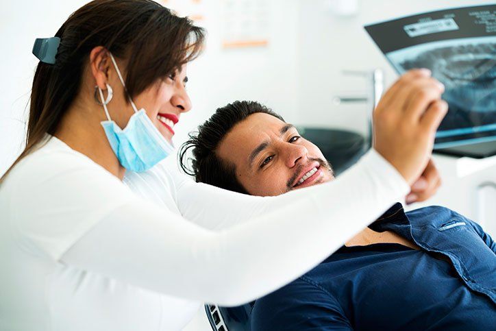 Dentist Showing the Dental X-ray — Alliance, OH — Kristine Sigworth, DDS