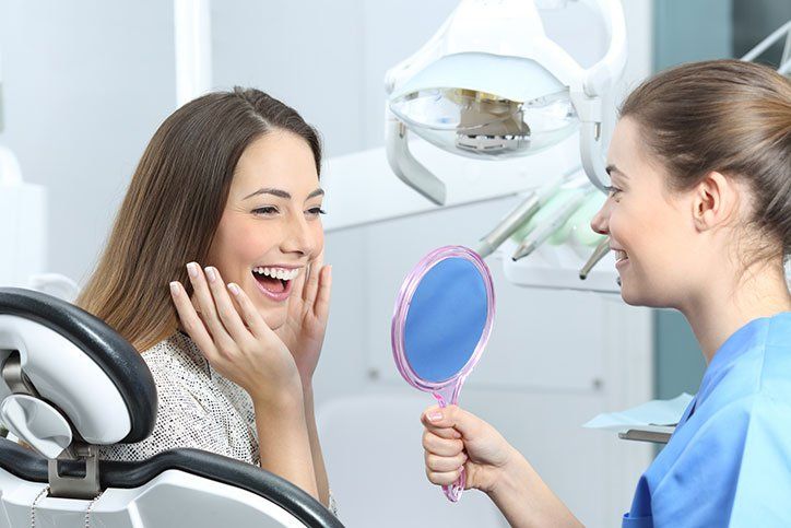 Woman Checking Her Teeth — Alliance, OH — Kristine Sigworth, DDS