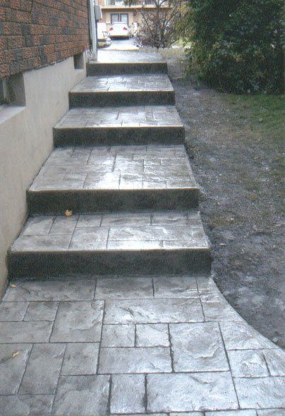 A set of stairs leading up to a brick building