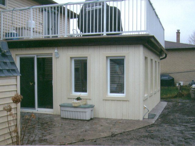 A house with a balcony on top of it
