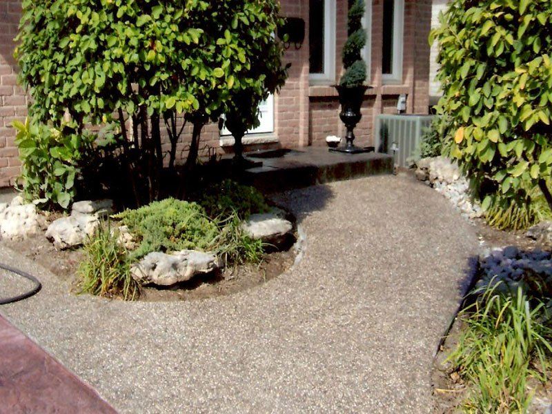 A brick house with a walkway leading to it