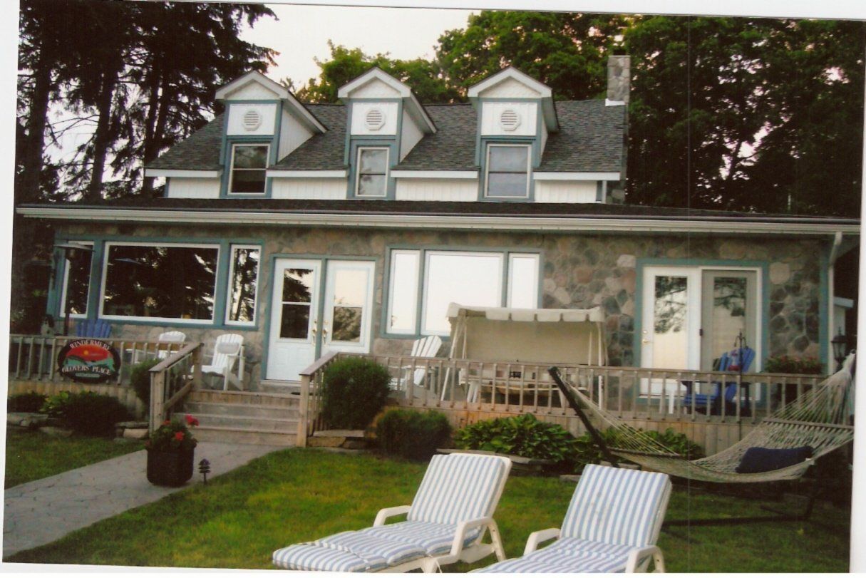 A pepsi sign is on the side of a house