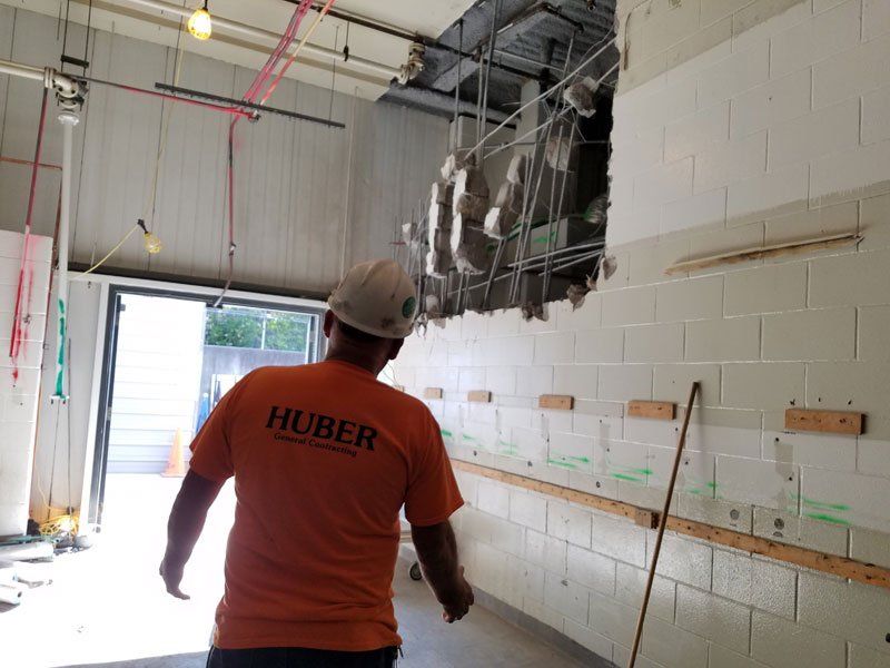 general contractor monitoring the construction