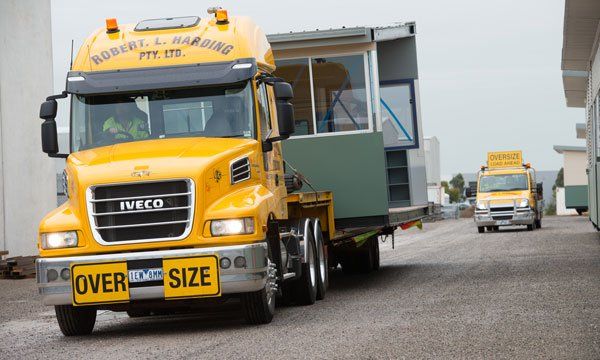 RL Harding Truck transporting small building