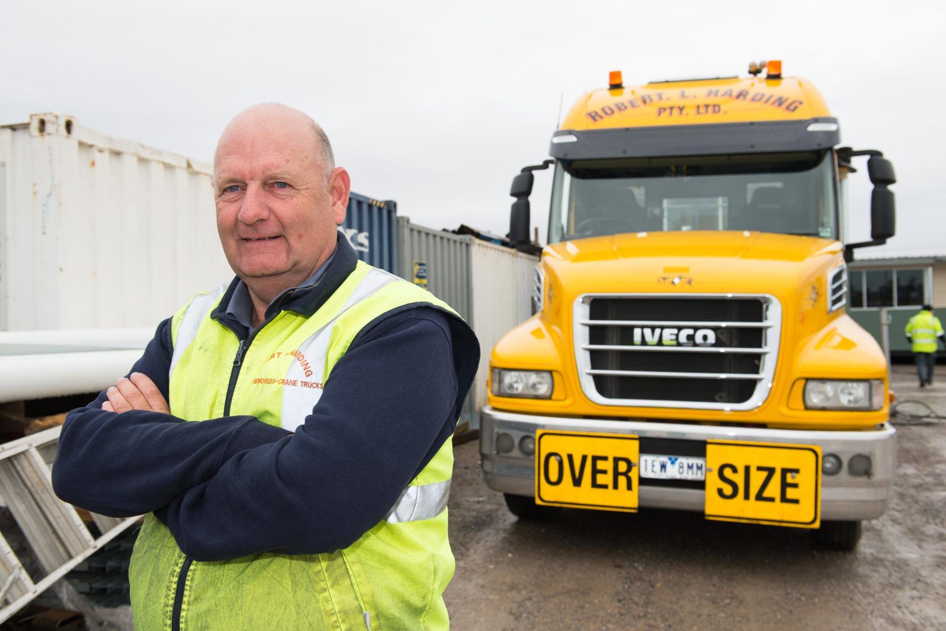 owner standing in front of truck