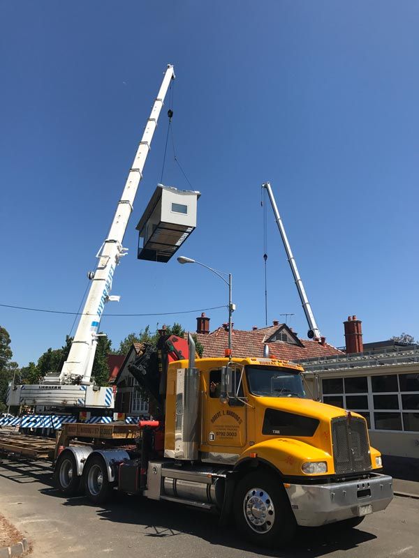 crane truck lifting building