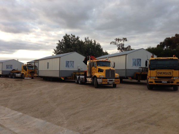 two portable schools on trucks