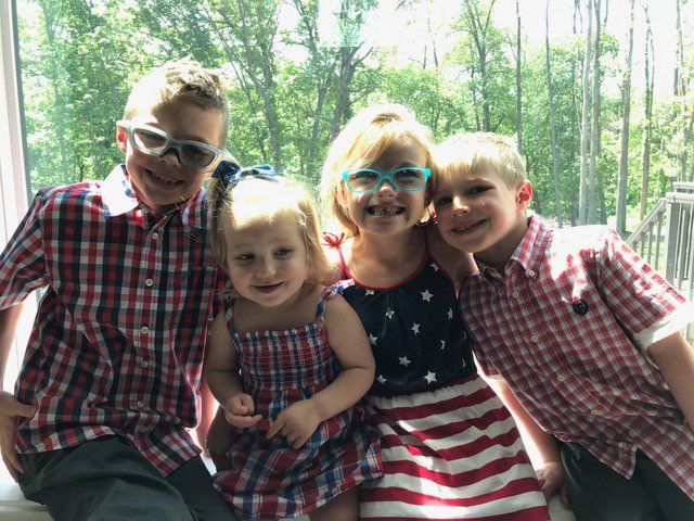 4 kids smiling