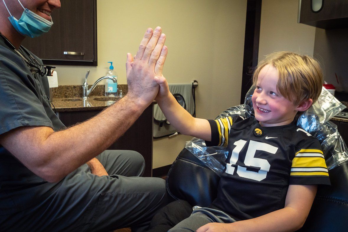 Dentist and a boy smiling
