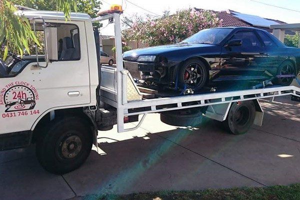 black car getting towed