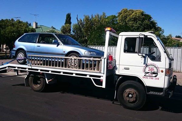 towing light blue car