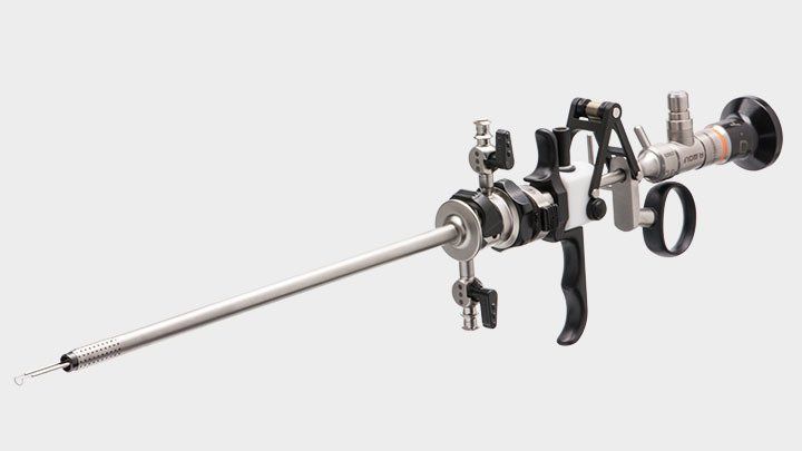 A close up of a surgical instrument on a white background.