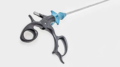 A pair of scissors with a blue handle on a white background.