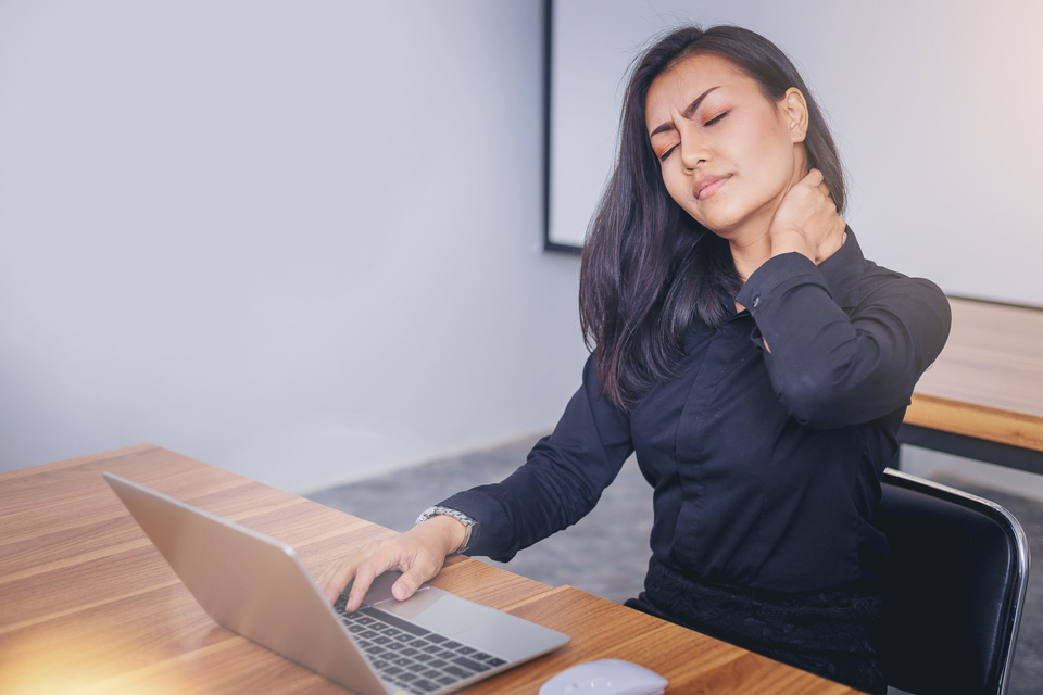 female worker with neck pain