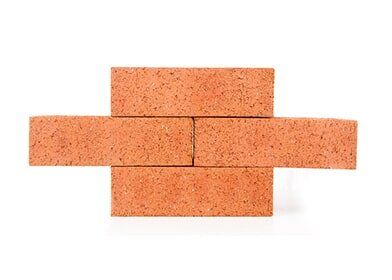 Four clay bricks building a wall — residential masonry services in Columbus, NE Four clay bricks building a wall — residential masonry services in Columbus, NE